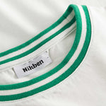 Close-up of round neck and stitching on white/green T-shirt