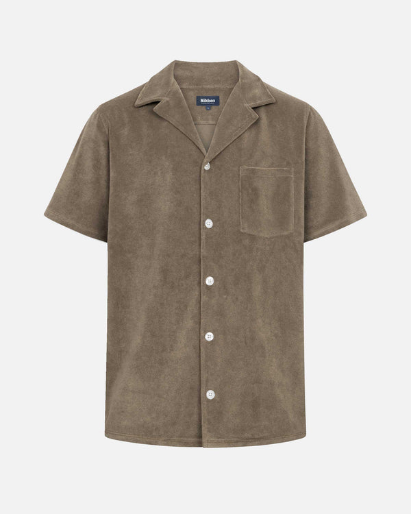 Brown short sleeve shirt with white button closure and one chest pocket