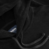 Close up of drawstings on a black hoodie.