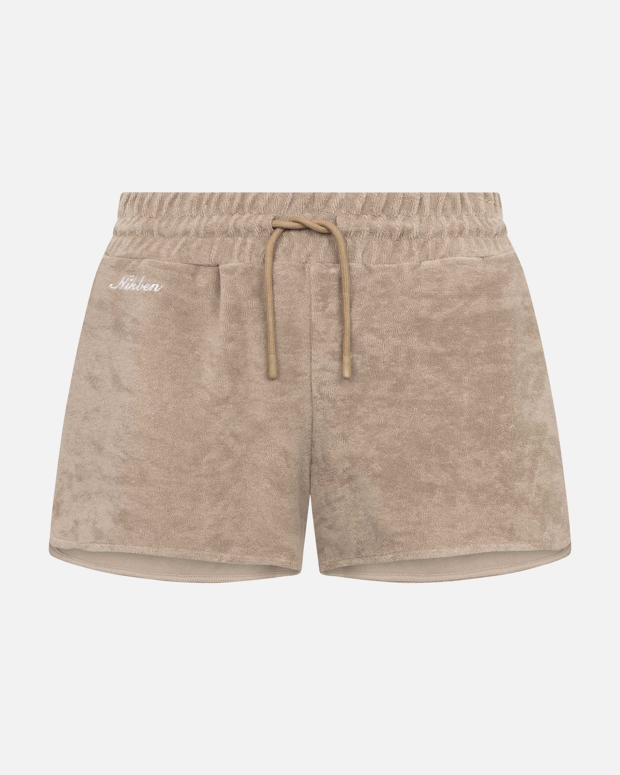 Light brown low cut shorts in terry toweling fabric with drawstring and two side pockets.