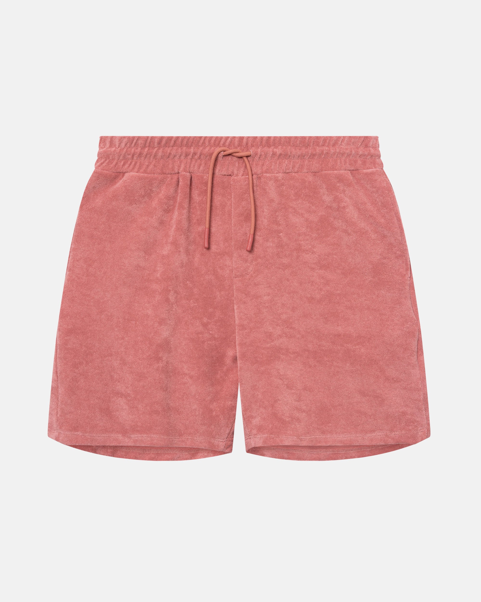 Terracotta colored mid length shorts in terry toweling fabric with drawdtring and two side pockets.