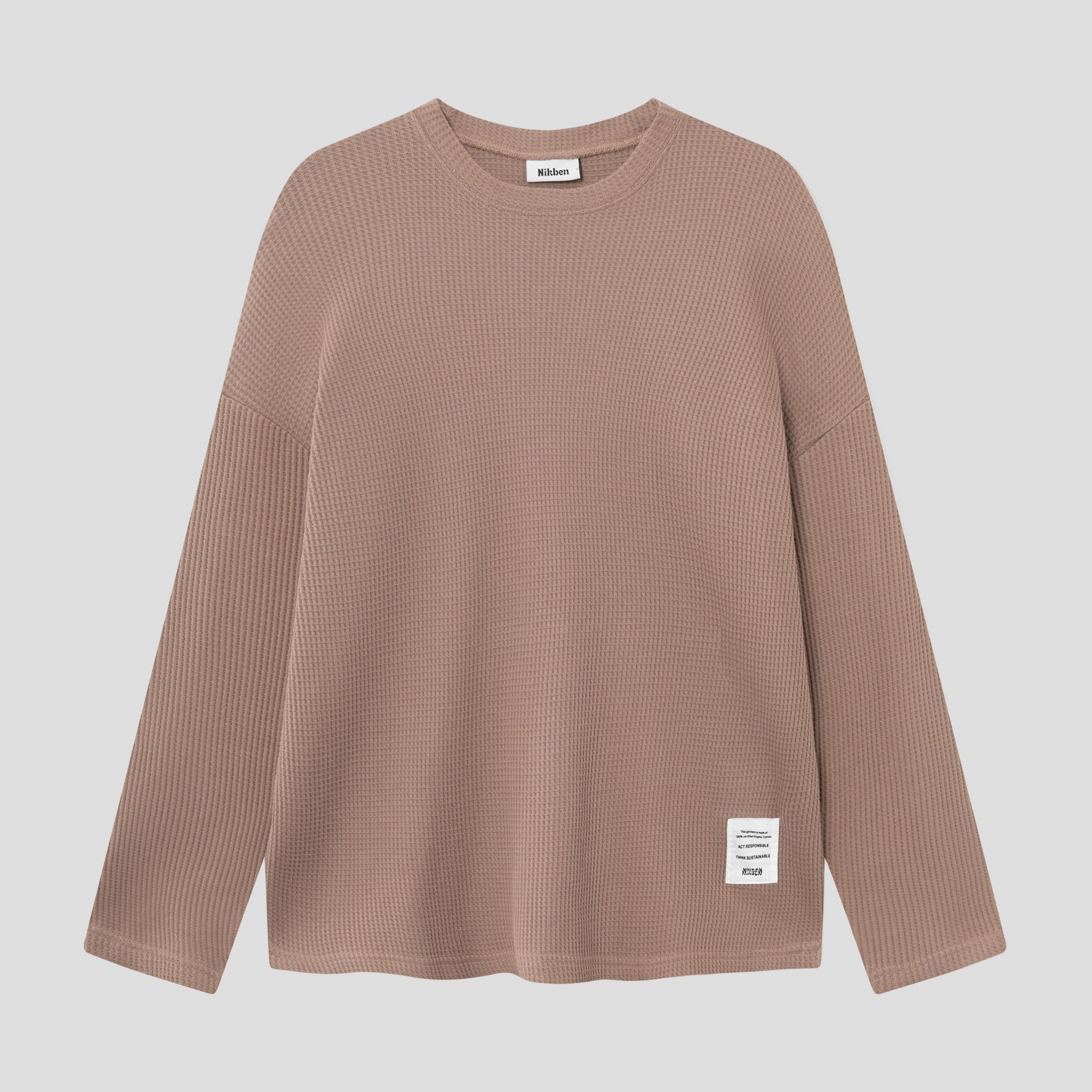 Brown waffle-patterned sweatshirt with a stitched-on material label.
