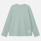 Mint green waffle-patterned sweatshirt with a stitched-on material label.