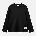 Black waffle-patterned sweatshirt with a stitched-on material label.