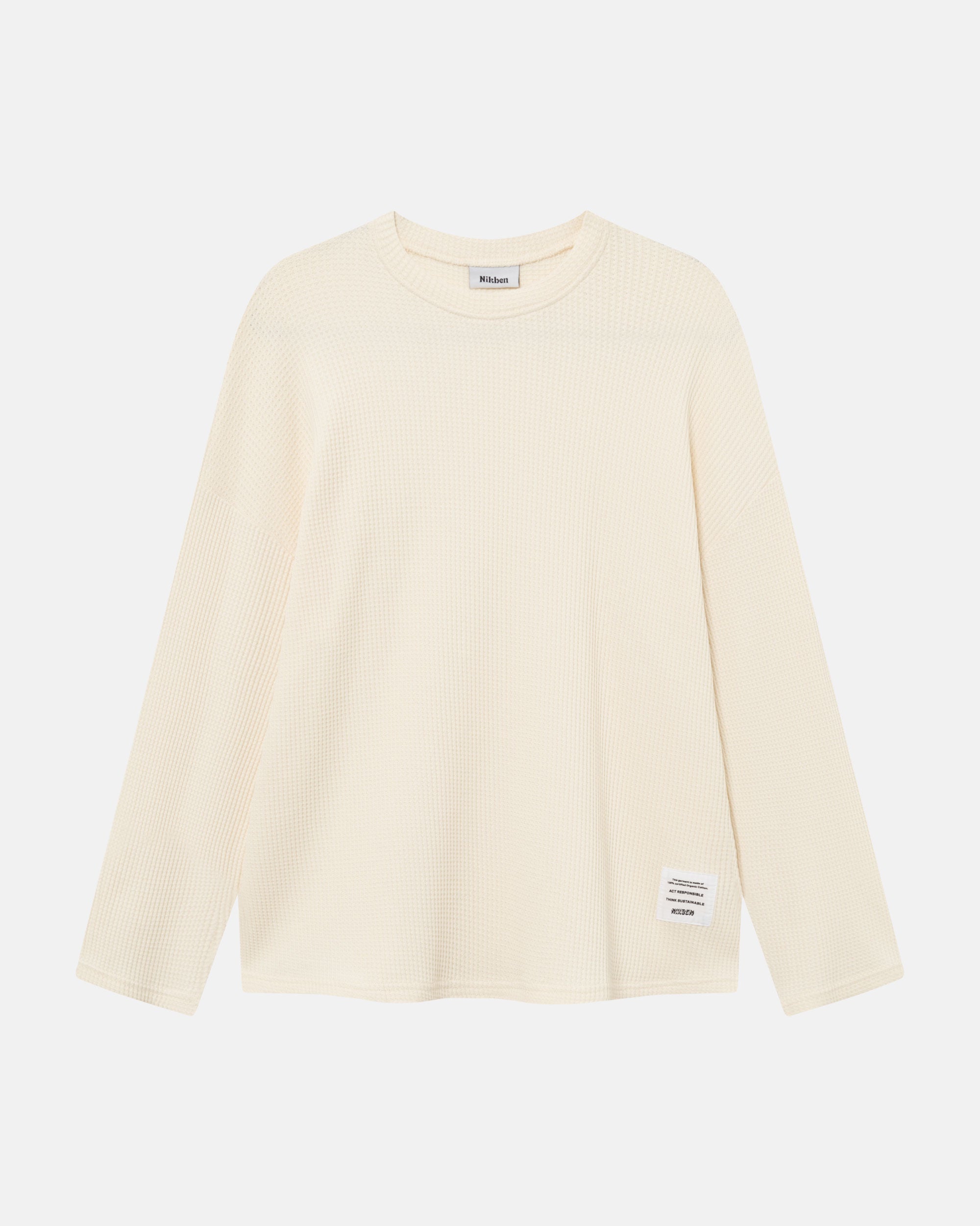 Off-white waffle-patterned sweatshirt with a stitched-on material label.