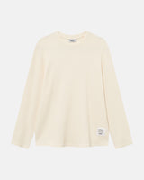 Off-white waffle-patterned sweatshirt with a stitched-on material label.