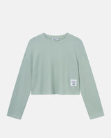 Mint green waffle-patterned cropped sweatshirt with a stitched-on material label.