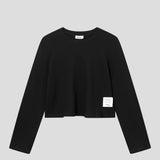 Black waffle-patterned cropped sweatshirt with a stitched-on material label.