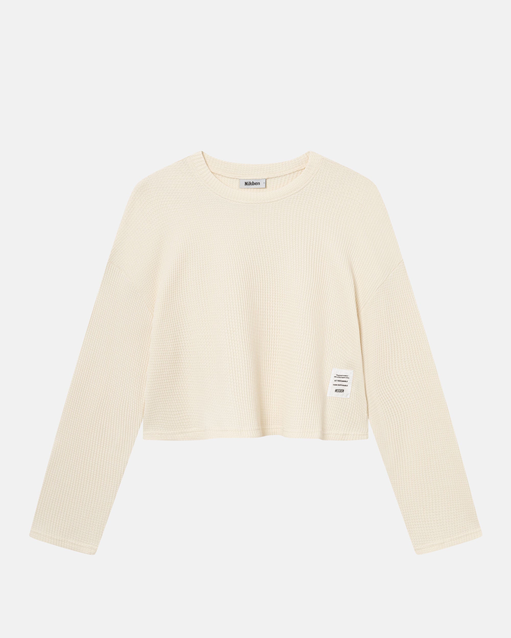 Off-white waffle-patterned cropped sweatshirt with a stitched-on material label.