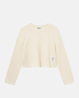Off-white waffle-patterned cropped sweatshirt with a stitched-on material label.