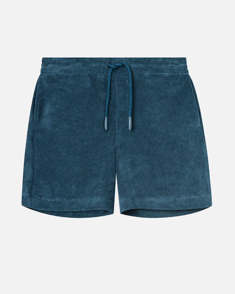 Dark blue mid length shorts in terry toweling fabric with drawdtring and two side pockets.