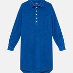 Blue kaftan in terry toweling fabric. With half button closure and one chest pocket