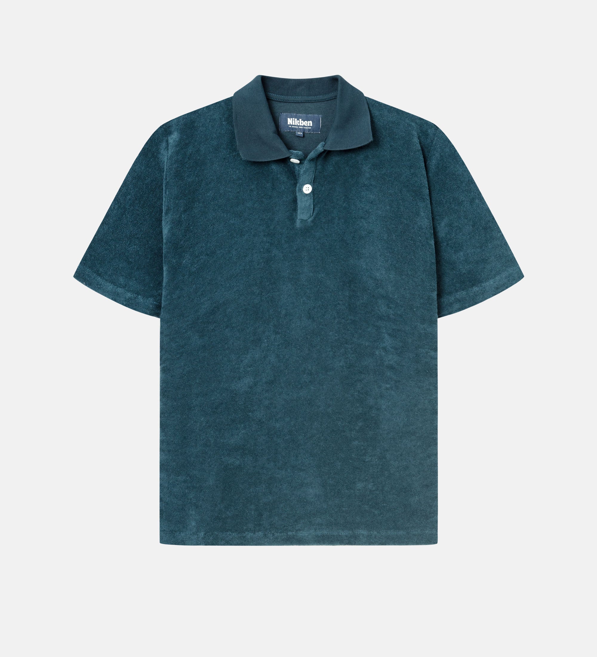Dark blue short sleeve piké shirt for kids in terry toweling fabric.